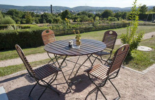 View from the 'Kaiserberg' to the city. In the front you could see a wooden table including four chairs. © view - die agentur 