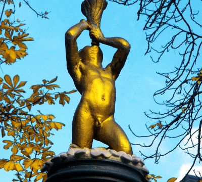 Closeup-view of the golden putto at top of the St. Martin's Fountain 